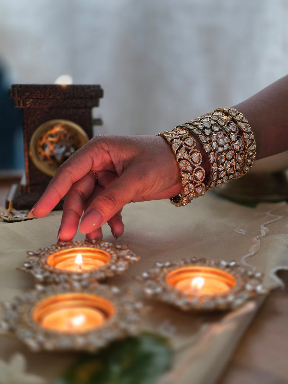 Lighting diyas for Karva Chauth, polki bangles